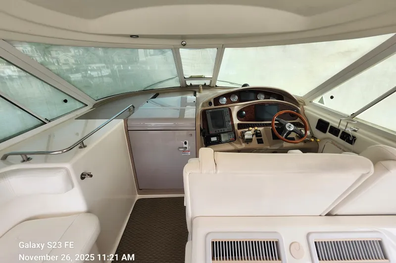 Magnolia Belle Yacht Photos Pics 2004 Sea Ray 390 Motor Yacht helm with modern controls and navigation equipment.