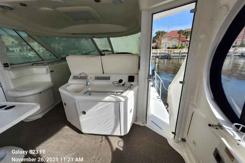 Magnolia Belle Yacht Photos Pics Interior of 2004 Sea Ray 390 Motor Yacht, Magnolia Belle, cockpit/helm area with wet bar.