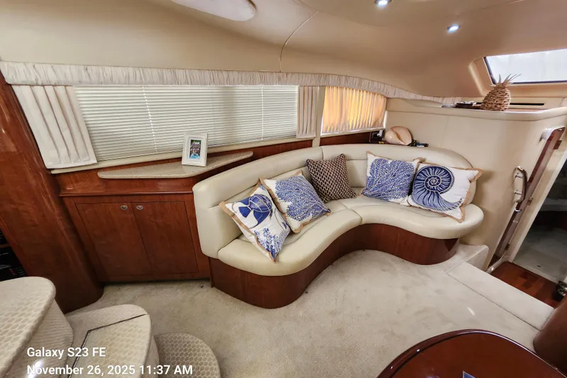 Magnolia Belle Yacht Photos Pics Luxurious 2004 Sea Ray 390 Motor Yacht interior with elegant seating and decorative pillows.