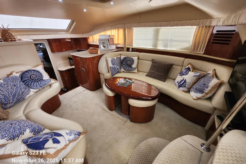 Magnolia Belle Yacht Photos Pics Luxurious interior of 2004 Sea Ray 390 Motor Yacht with elegant seating and decor.