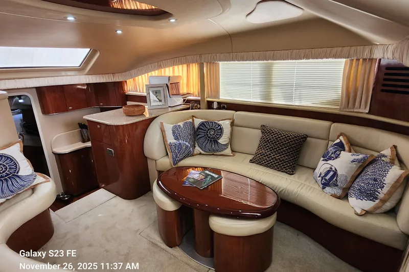 Magnolia Belle Yacht Photos Pics Luxurious interior of a 2004 Sea Ray 390 Motor Yacht with elegant seating and decor.