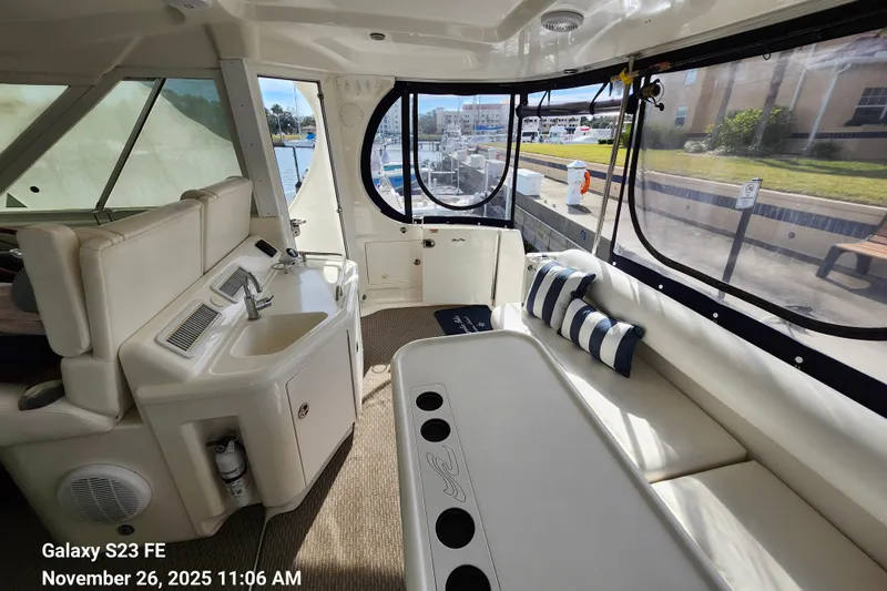 Magnolia Belle Yacht Photos Pics Bar and seating behind helm station. View also shows entryway to the boat on the starboard side.