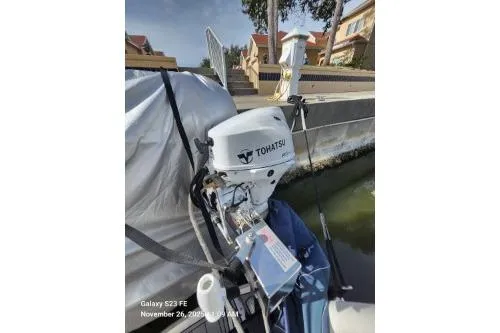Magnolia Belle Yacht Photos Pics 2024 Tohatsu outboard motor on a docked 2004 Sea Ray 390 Motor Yacht.