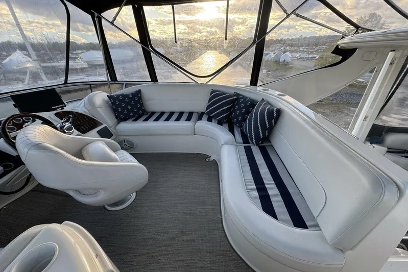 Done Building Yacht Photos Pics Luxurious 2008 Meridian 459 Motoryacht interior with plush seating and nautical-themed cushions.