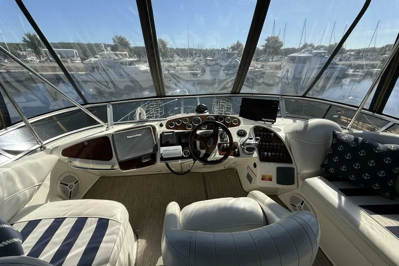 Done Building Yacht Photos Pics 2008 Meridian 459 Motoryacht helm with luxurious seating and advanced navigation equipment.