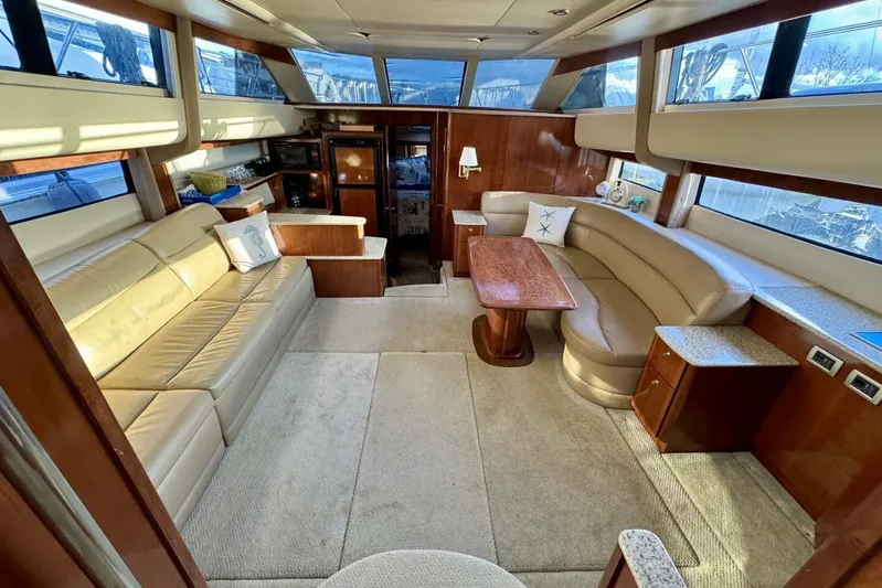 Done Building Yacht Photos Pics Luxurious interior of 2008 Meridian 459 Motoryacht with plush seating and elegant wood finishes.