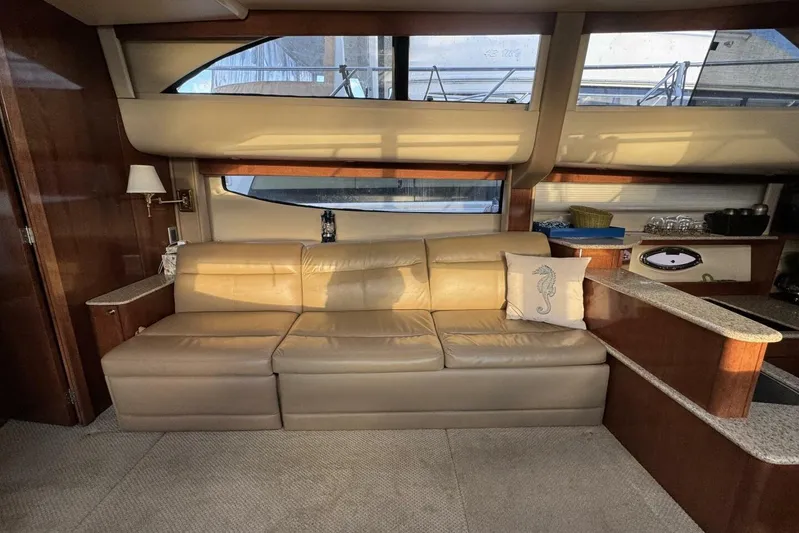 Done Building Yacht Photos Pics Luxurious interior of 2008 Meridian 459 Motoryacht with beige leather sofa and elegant decor.