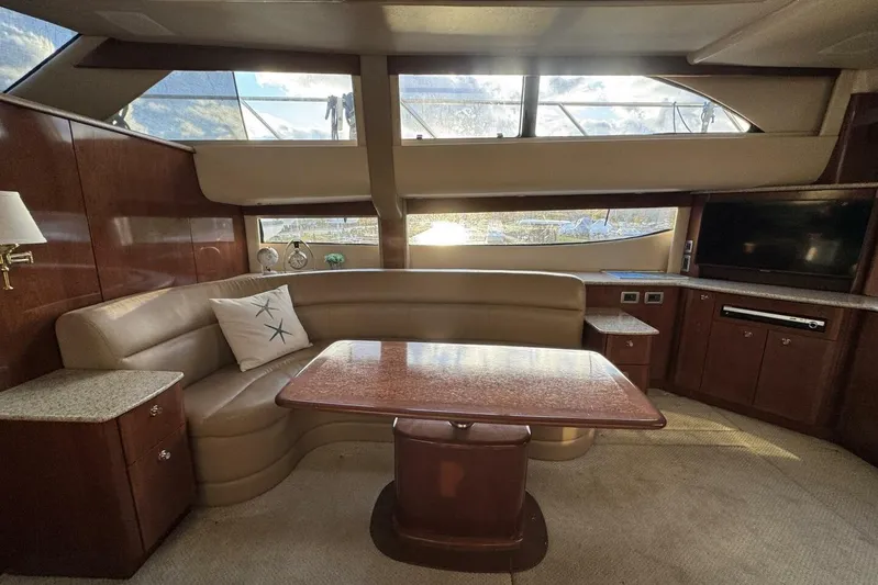 Done Building Yacht Photos Pics Luxurious interior of 2008 Meridian 459 Motoryacht with elegant seating and large windows.