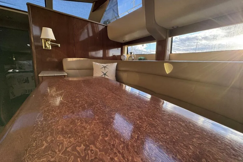 Done Building Yacht Photos Pics Luxurious interior of 2008 Meridian 459 Motoryacht with polished wood table and plush seating.
