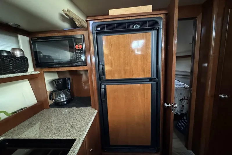 Done Building Yacht Photos Pics 2008 Meridian 459 Motoryacht kitchen with microwave, fridge, and coffee maker.