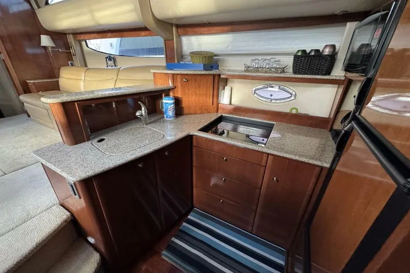 Done Building Yacht Photos Pics Luxurious 2008 Meridian 459 Motoryacht interior with modern kitchen and elegant seating area.