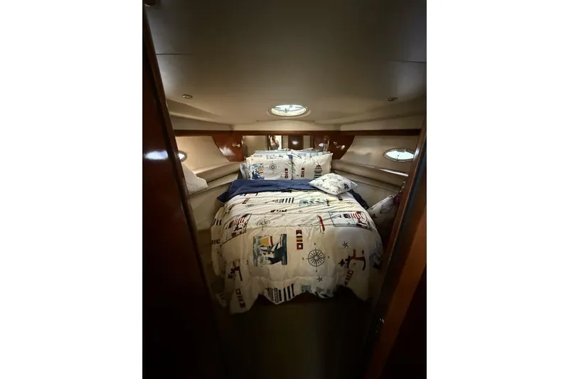 Done Building Yacht Photos Pics Luxurious cabin interior of 2008 Meridian 459 Motoryacht with nautical-themed bedding.