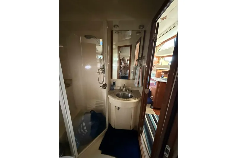 Done Building Yacht Photos Pics Bathroom interior of 2008 Meridian 459 Motoryacht with sink and shower.