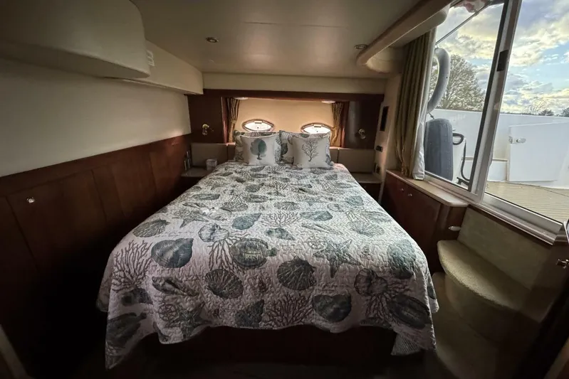 Done Building Yacht Photos Pics Luxurious bedroom interior of 2008 Meridian 459 Motoryacht with ocean-themed bedding.