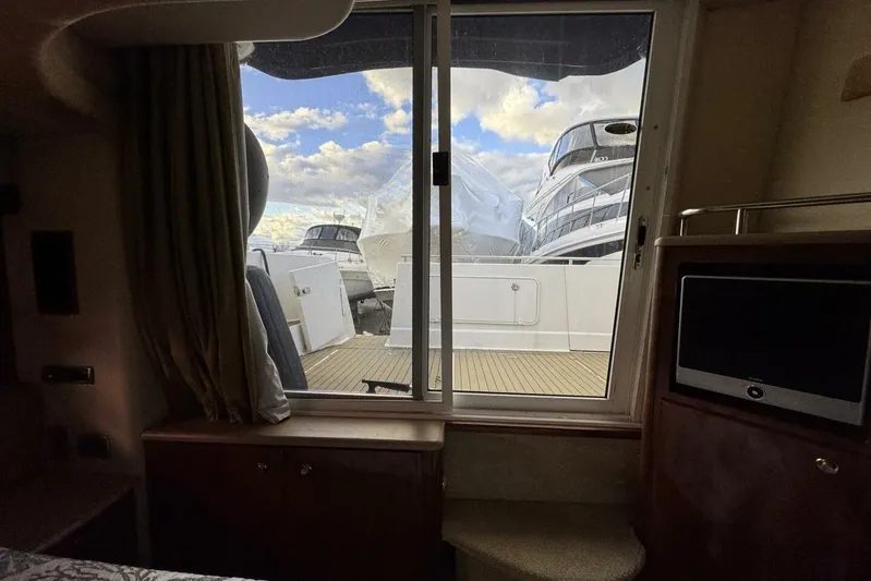 Done Building Yacht Photos Pics Interior view from a 2008 Meridian 459 Motoryacht, showcasing a window with a marina view.