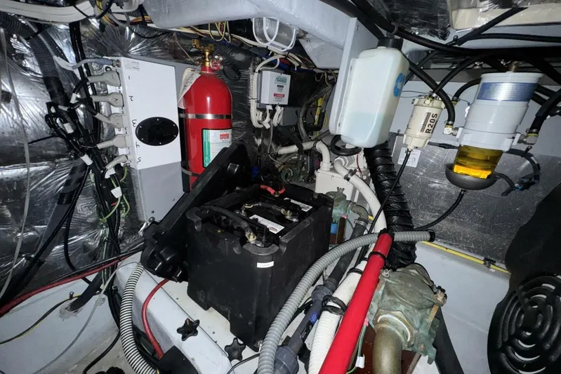 Done Building Yacht Photos Pics Engine room of 2008 Meridian 459 Motoryacht with battery, wiring, and fire extinguisher.