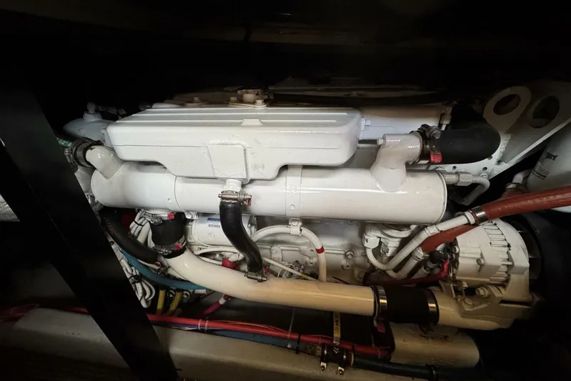 Done Building Yacht Photos Pics Engine compartment of a 2008 Meridian 459 Motoryacht, showcasing mechanical components and hoses.