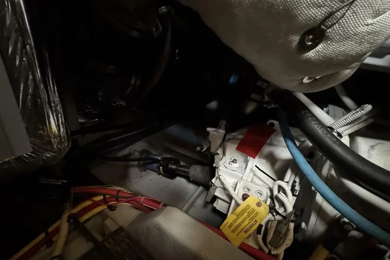 Done Building Yacht Photos Pics Engine compartment of 2008 Meridian 459 Motoryacht with visible wiring and hoses.