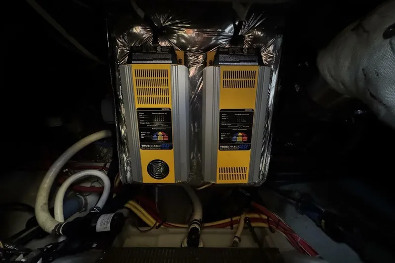 Done Building Yacht Photos Pics Engine room of 2008 Meridian 459 Motoryacht with battery chargers and wiring.