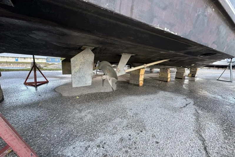 Done Building Yacht Photos Pics Underside view of a 2008 Meridian 459 Motoryacht on blocks, showing propeller and rudder.