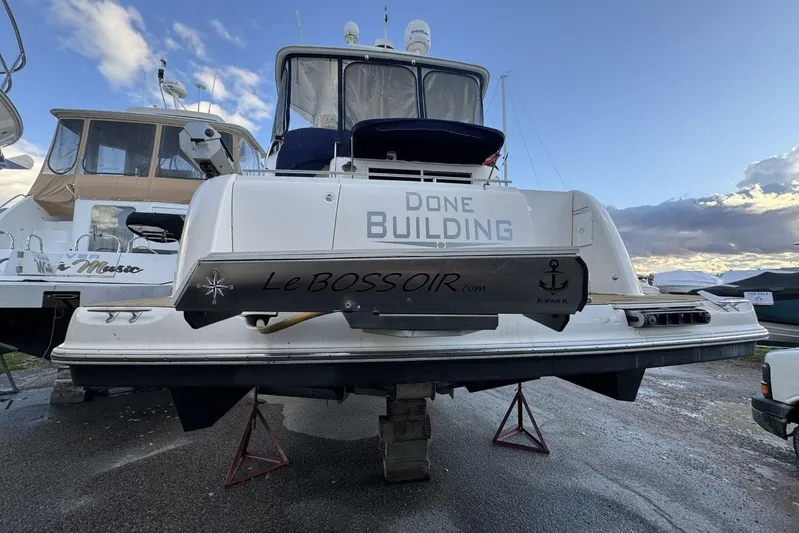 Done Building Yacht Photos Pics 2008 Meridian 459 Motoryacht on stands, with "Done Building" text on the stern.