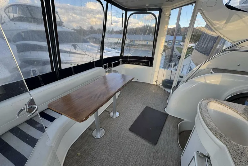 Done Building Yacht Photos Pics 2008 Meridian 459 Motoryacht interior with seating, table, and panoramic windows.