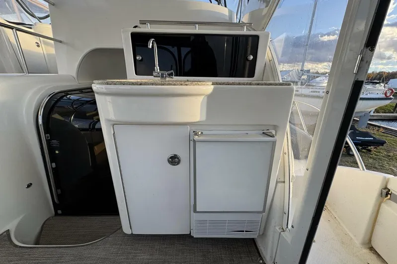 Done Building Yacht Photos Pics 2008 Meridian 459 Motoryacht interior with sink and storage, showcasing sleek design.