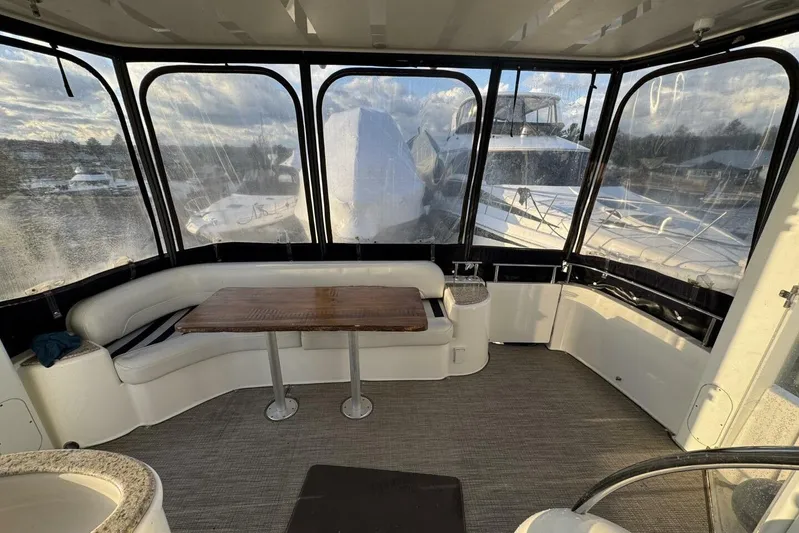 Done Building Yacht Photos Pics 2008 Meridian 459 Motoryacht interior with panoramic windows and elegant seating area.