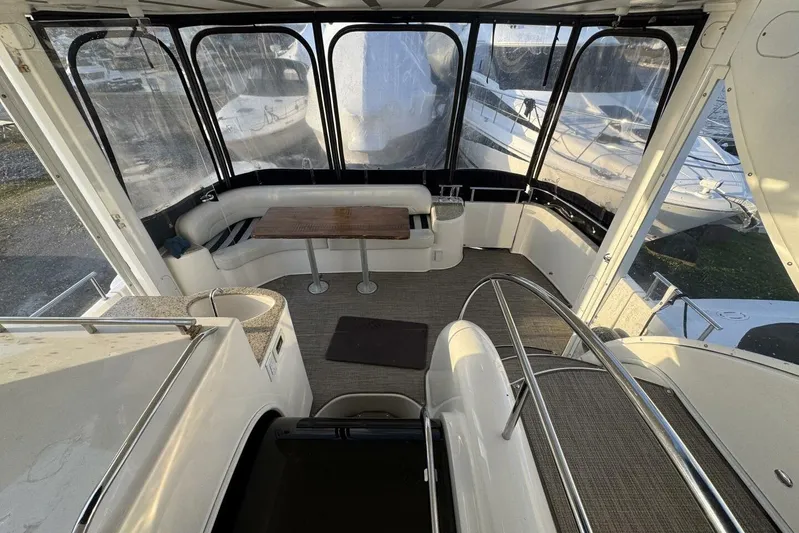 Done Building Yacht Photos Pics 2008 Meridian 459 Motoryacht interior with seating, table, and panoramic windows.