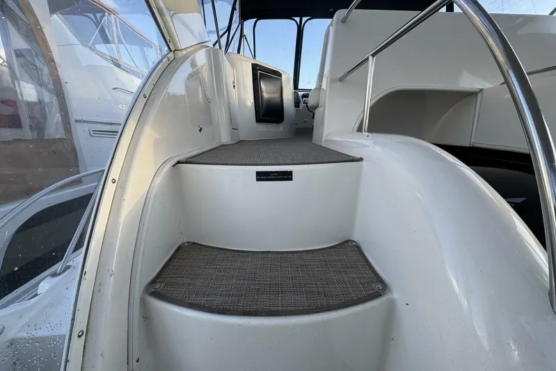 Done Building Yacht Photos Pics Staircase on 2008 Meridian 459 Motoryacht, leading to upper deck with railing.