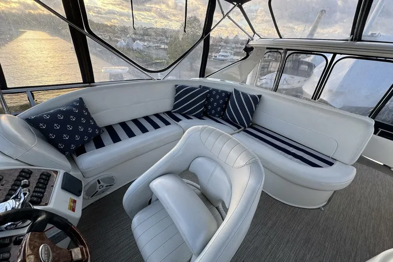 Done Building Yacht Photos Pics Luxurious interior of 2008 Meridian 459 Motoryacht with plush seating and nautical-themed cushions.