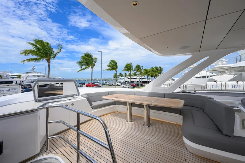  Yacht Photos Pics Luxurious 2026 Princess S72 yacht deck with elegant seating and ocean view.