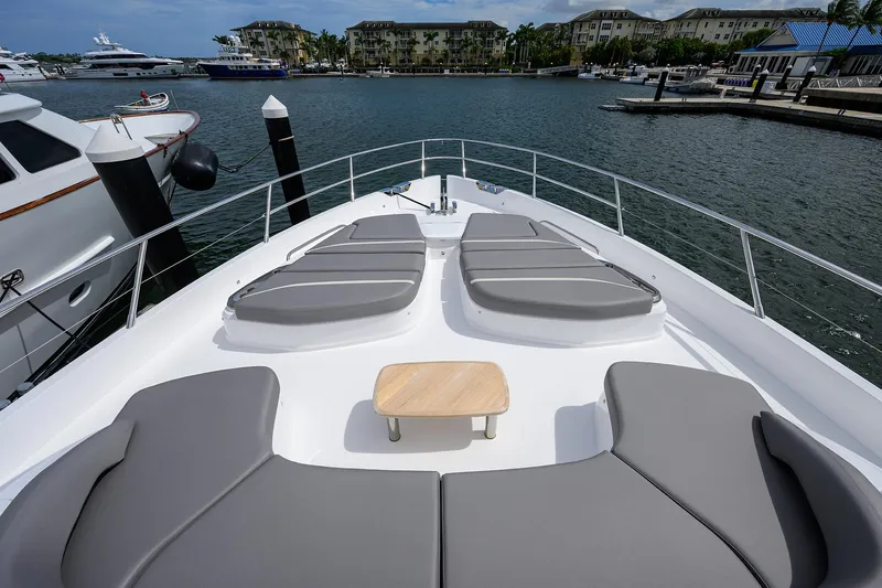  Yacht Photos Pics Luxury 2026 Princess S72 yacht deck with sun loungers in marina setting.