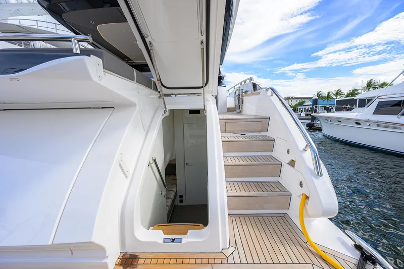  Yacht Photos Pics Luxurious 2026 Princess S72 yacht with elegant wooden steps and sleek design.