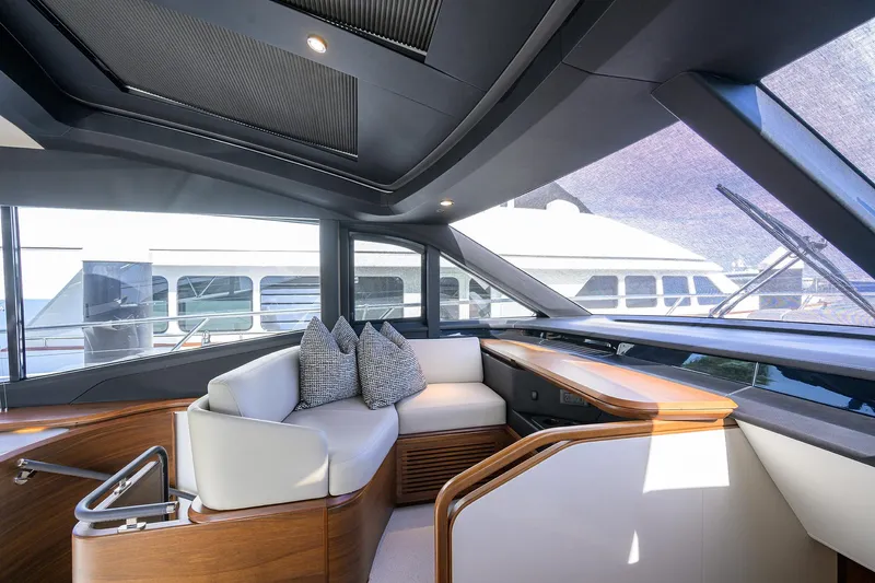  Yacht Photos Pics Luxurious interior of 2026 Princess S72 yacht with modern seating and elegant wood finishes.
