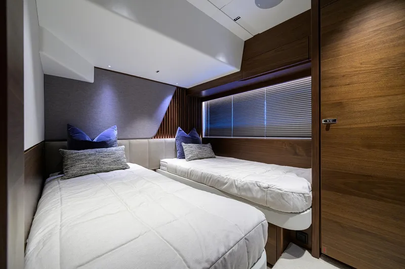  Yacht Photos Pics Luxurious twin cabin interior of 2026 Princess S72 yacht, featuring modern design and cozy bedding.