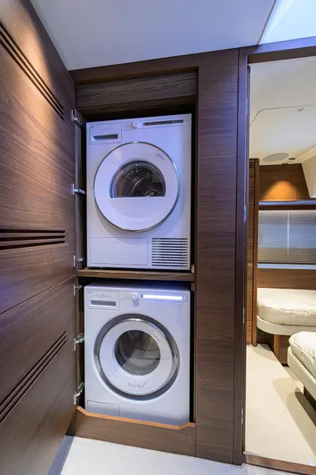  Yacht Photos Pics Stacked washer and dryer in 2026 Princess S72 yacht interior.