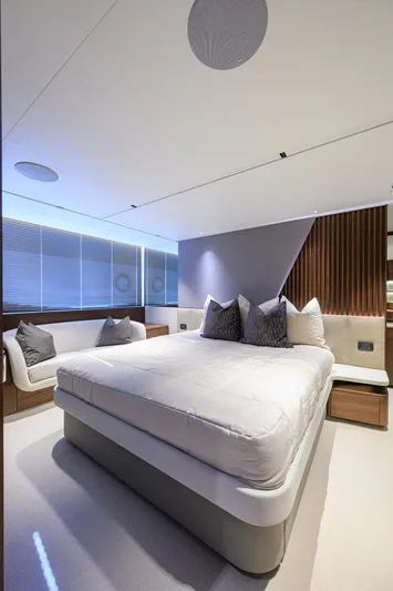  Yacht Photos Pics Luxurious bedroom interior on 2026 Princess S72 yacht, featuring modern design and elegant furnishings.