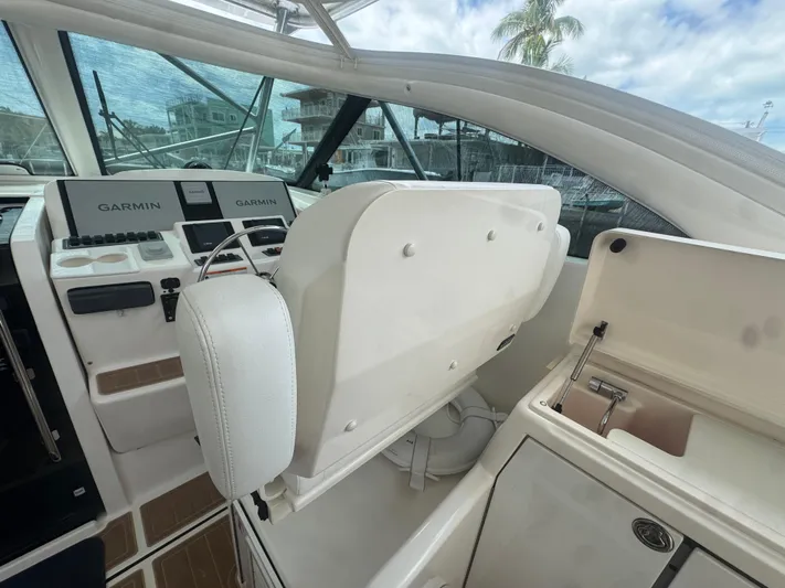  Yacht Photos Pics 2006 Tiara Yachts 4200 Open helm with Garmin navigation and storage compartment.