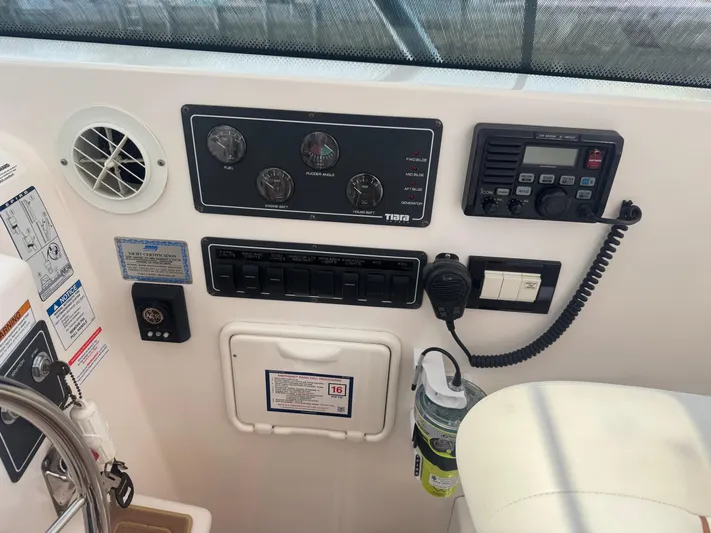  Yacht Photos Pics Control panel of a 2006 Tiara Yachts 4200 Open, featuring gauges and communication equipment.