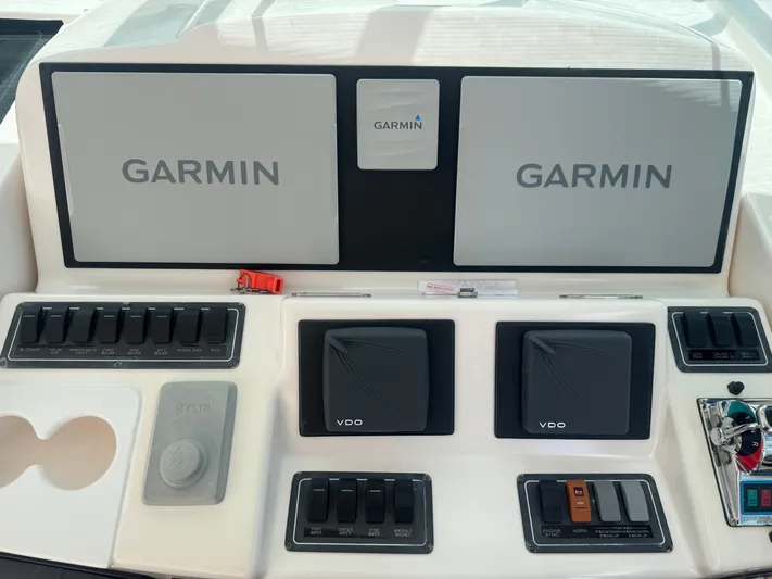  Yacht Photos Pics Control panel of a 2006 Tiara Yachts 4200 Open with Garmin displays and switches.