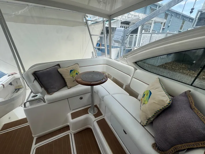  Yacht Photos Pics 2006 Tiara Yachts 4200 Open interior with cushioned seating and decorative pillows.