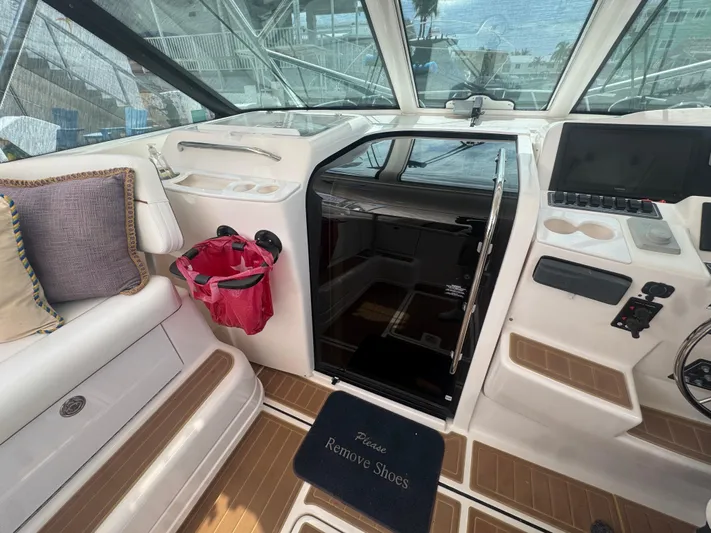  Yacht Photos Pics 2006 Tiara Yachts 4200 Open interior with seating, helm, and cabin entrance.