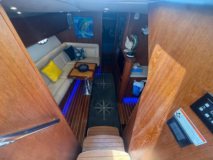  Yacht Photos Pics Luxurious interior of 2006 Tiara Yachts 4200 Open with cozy seating and nautical decor.