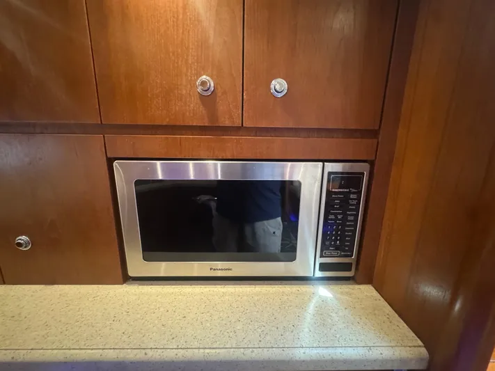  Yacht Photos Pics Microwave in 2006 Tiara Yachts 4200 Open, set in wooden cabinetry.