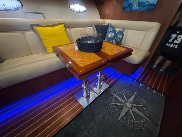  Yacht Photos Pics Interior of 2006 Tiara Yachts 4200 Open with cozy seating and nautical decor.