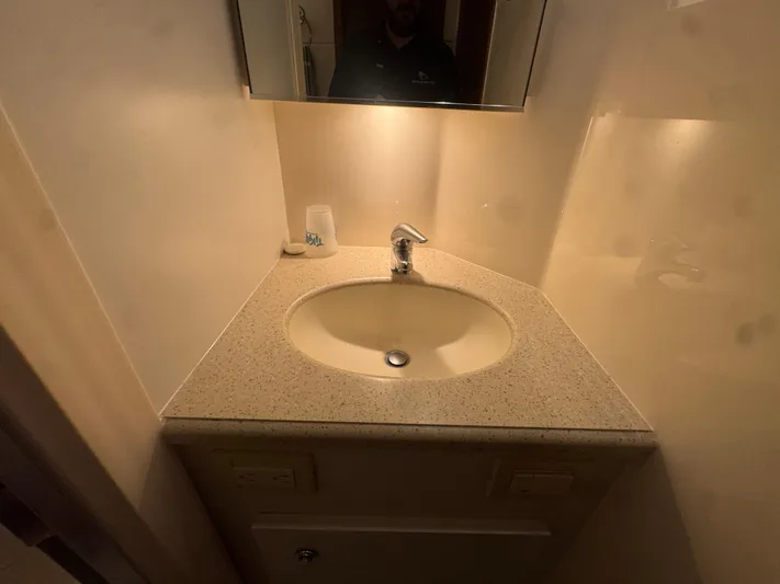  Yacht Photos Pics Compact bathroom sink area in a 2006 Tiara Yachts 4200 Open.