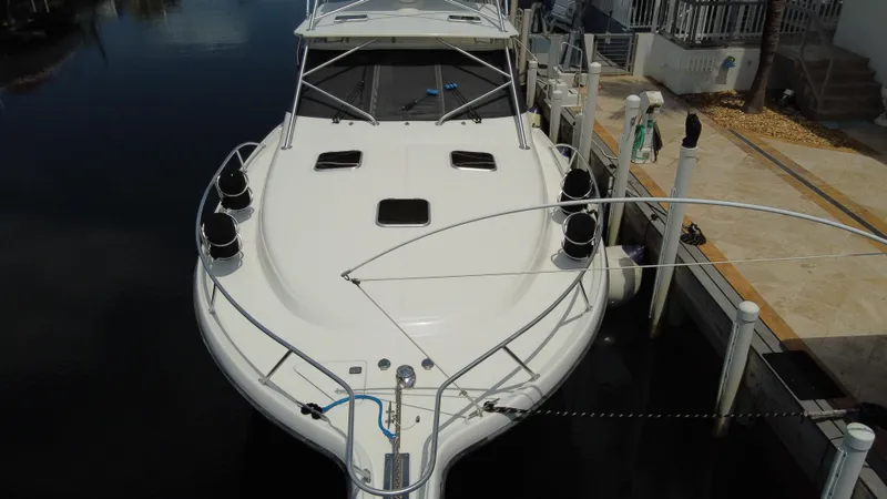  Yacht Photos Pics 2006 Tiara Yachts 4200 Open docked, showcasing sleek design and spacious deck.