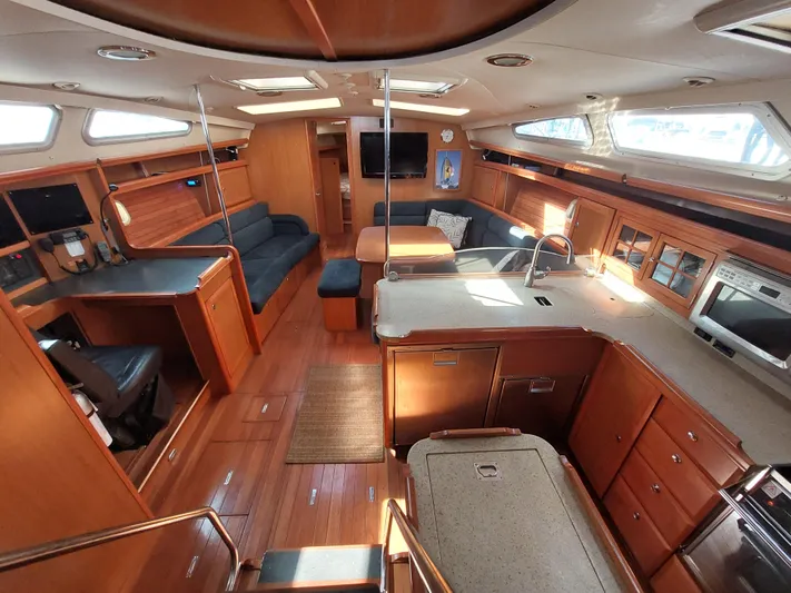 "heron" Yacht Photos Pics Spacious interior of 2009 Hunter 49 yacht with modern kitchen and seating area.
