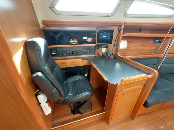 "heron" Yacht Photos Pics Interior of 2009 Hunter 49 yacht with navigation station and leather chair.